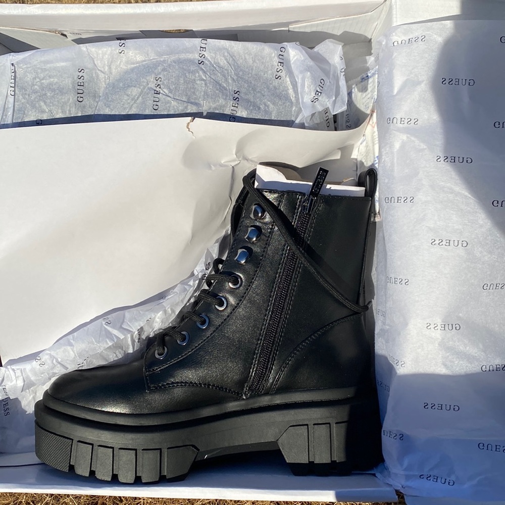 Guess black leather platform combat boots.